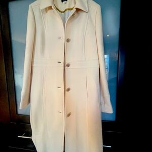 Women’s light cream colored coat. Beautifully made!  Runs small